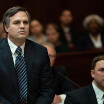 White guy in a suit looking serious