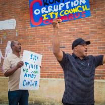 Man with protest sign