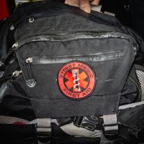 Black medic bag with red First Aid symbol on it