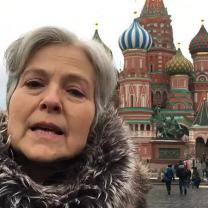 Close up of Jill Stein with famous Moscow building in background