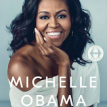 Pretty black woman smiling with long black hair waving in the wind wearing a white shirt that is off one shoulder and words Becoming at top and MIchelle Obama below