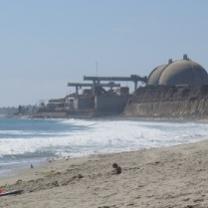 Round topped nuclear plant right on the beach with water coming in