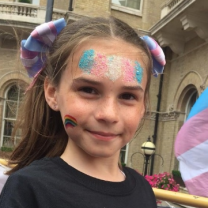 Young girl with trans flag