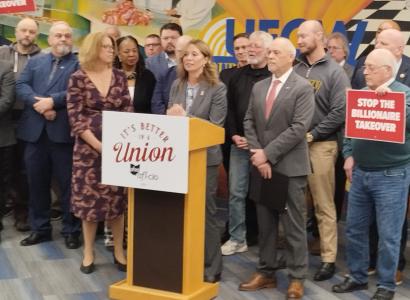 Union members surrounding Amy Acton at press event