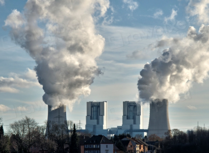 Smoke stacks billowing smoke at plant