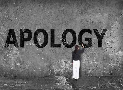 Apology painted on wall