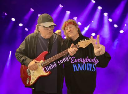 Bob playing guitar and Dan giving peace sign