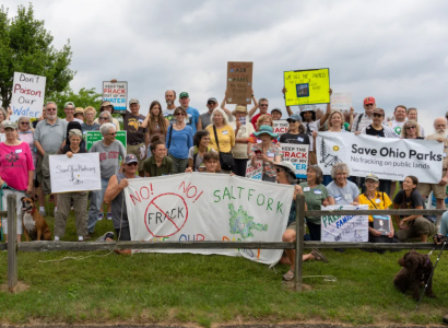 People posing with signs