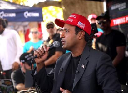 Vivek Ramaswamy wearing MAGA hat at Turning Point USA event