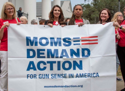 Women holding a banner