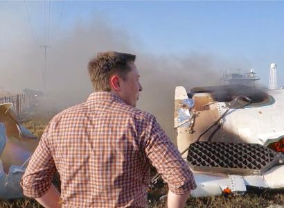 Elon Musk overlooking the remains of F9R