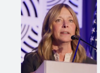 White woman at a podium