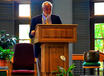 Man talking at a podium