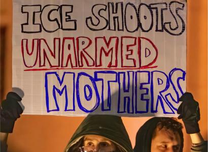 Sign saying ICE shoots unarmed moms