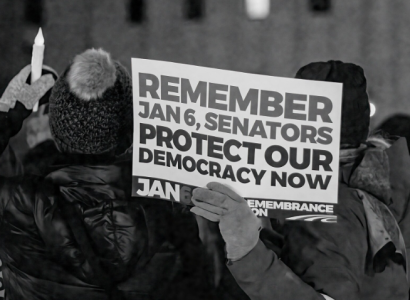 Protester hoding sign Protect our democracy now