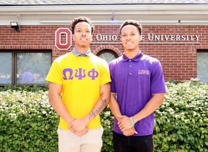 TWo young men posing