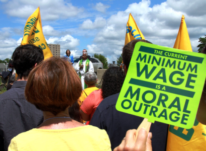 Sign saying Minimum Wage is a Moral Outrage