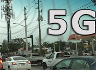 Words 5G with street scene with cars and a cell tower 