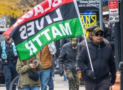 Marcher with Black Lives Matter flag