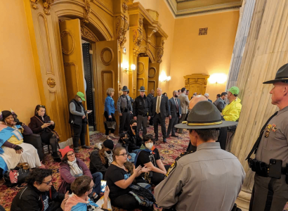 Cops surrounding people at a sit-in