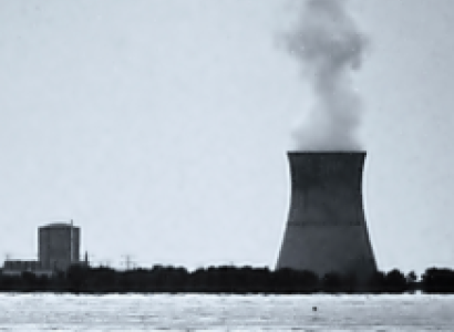 Nuke plant on the water with smoke