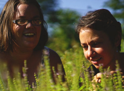 Two young women out in a field