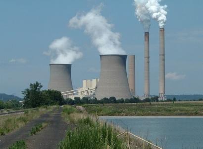 Smoking stacks on a plant by water