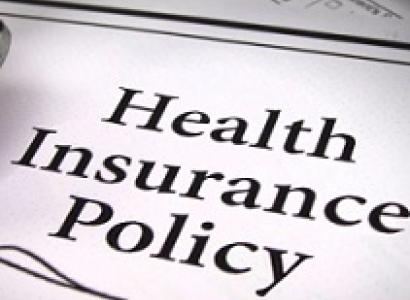 Words Health Insurance Policy with a squiggly line below