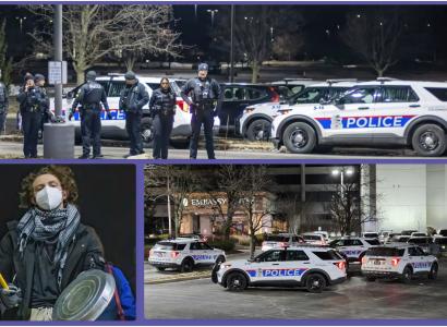 Police cars and officers at protest
