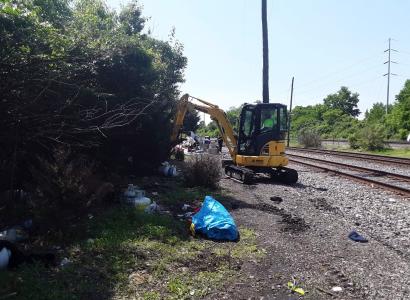 Bulldozer taking down a houseless encampment