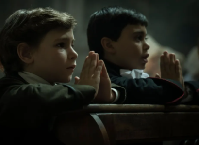 Two little boys praying