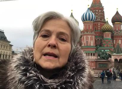 Close up of Jill Stein with famous Moscow building in background