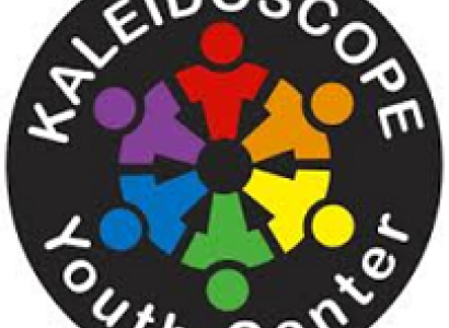 Round black circle with rainbow stick figures in a circle in the middle and words Kaleidoscope Youth Center