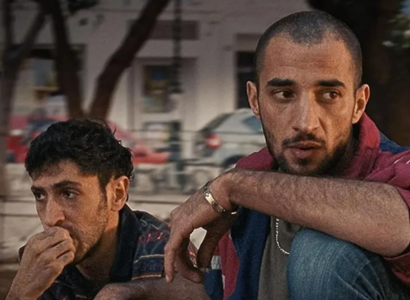 Two men sitting together