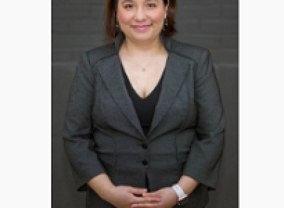 Young dark haired woman smiling