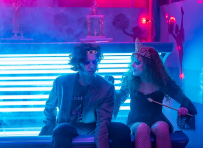 Young man and woman sitting by a window