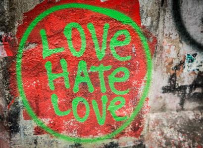Love Hate Love spray painted on a wall