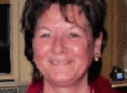 Smiling white woman with short brown hair