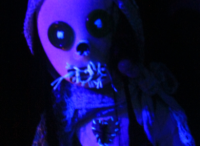 Creepy doll head in blue light