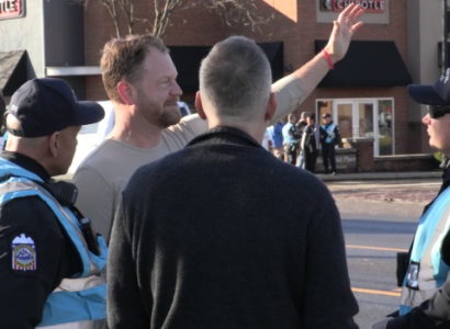 Men talking with police on the street