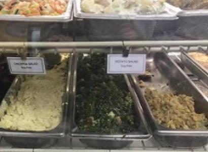 Lots of food in different trays all labeled