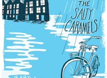 Light blue colored background black and white cartoony houses at top left and clouds and the words the Salty Caramels over a bike and white puddles and the words in white Baby Blue
