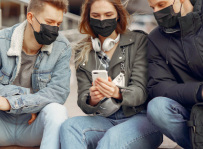 Three young people wearing black face masks