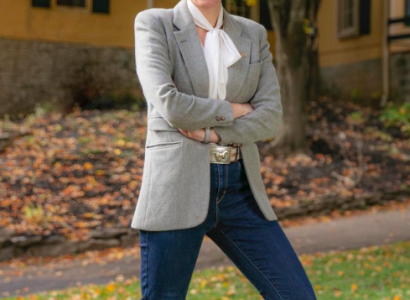 Young woman smiling and standing outside