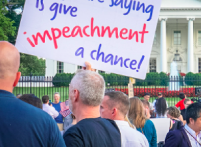 Sign saying All we are saying is give impeachment a chance