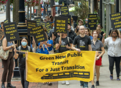 People with banners and signs