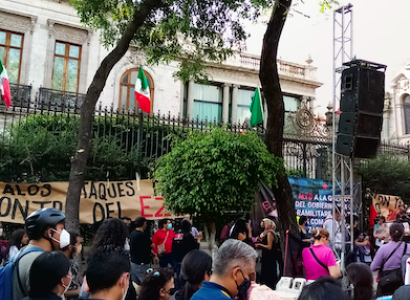 Reporters and buildings with flags