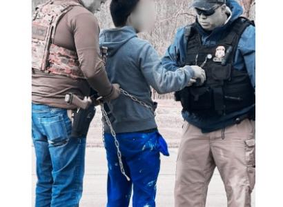 Man being arrested by ICE