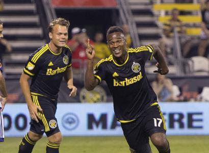Two guys playing soccer