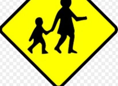  Yellow diamond with black silhouette of woman holding a kids hand walking